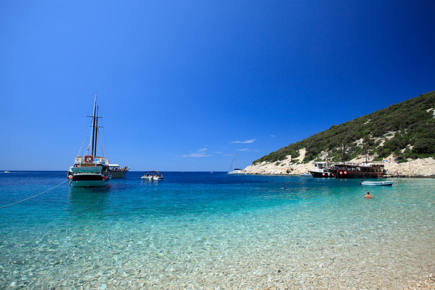 Picture of a boat on blue water bay